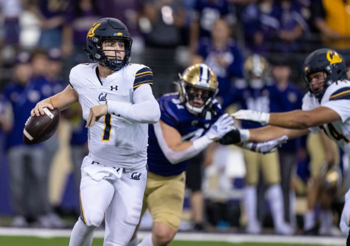 California Golden Bears quarterback Chase Garbers (7) scrambles out of the pocket during the second half against the Washington Huskies at Alaska Airlines Field at Husky Stadium.